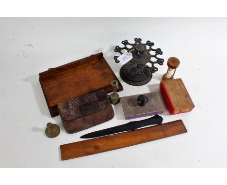 Mixed works of art, to include a cast metal pipe stand, an oak book stand, a Jerusalem olivewood rule, a small egg timer, a t
