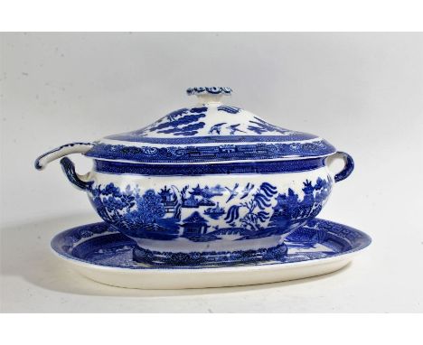 19th Century Willow pattern transferware soup tureen on stand, with matched ladle and lid, the stand 39cm wide&nbsp;