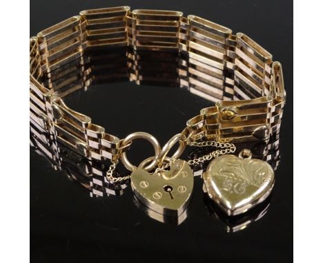 A 9ct gold heart lock gate link charm bracelet, together with a 9ct heart pendant, 19.5g total 