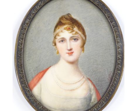 An early 19th century miniature watercolour on ivory, head and shoulders portrait of a Classical woman, signed with monogram,