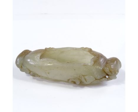 A Chinese relief carved jade bowl, with animal mounts, length 11cm 