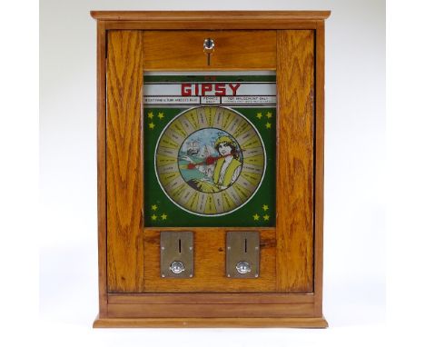 A gypsy fortune teller penny in the slot machine, re-cased original late 1950s machine working on an old penny, possible by B