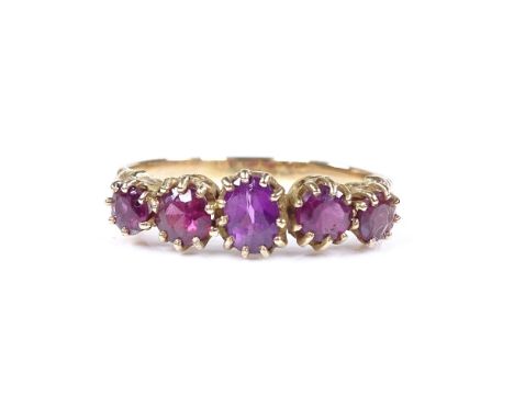 An unmarked gold 5-stone amethyst ring, setting height 6.7mm, size T, 3g 