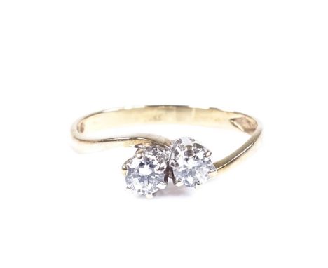 A 9ct gold 2-stone diamond crossover ring, total diamond content approx 0.3cts, maker's marks JM Co, size N, 1.4g 