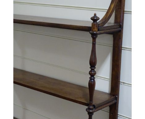 A 19th century mahogany wall hanging 3-tier open display shelf, with spindled columns, width 3' 7", height 6' 4" 