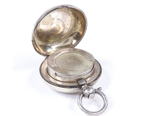 A circular silver sovereign case, with engine turned decoration, by Dennison Watch Case Co, hallmarks Birmingham 1906, diamet