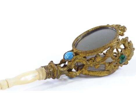 A Victorian gilt-metal posy holder, with inset mirrors and paste stones, and turned mother-of-pearl handle, length 15cm 