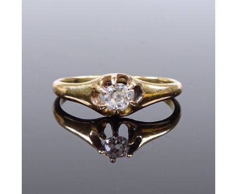 An unmarked gold solitaire diamond gypsy ring, settings test as 18ct gold, diamond approx 0.15ct, setting height 6.4mm, size 