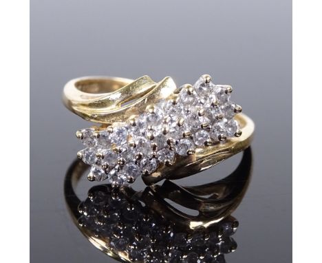 A 14ct gold diamond cluster crossover ring, setting height 11.5mm, size R, 3.5g (1 replacement stone not diamond) 