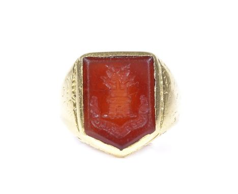 An Antique unmarked gold carnelian intaglio seal ring, with castle emblem and "Inter Primos" motto, setting height 16.1mm, si