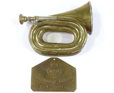 An Antique Buglet brass military bugle, by H Keat &amp; Sons of London, length 18cm, and a Grenadier Guards plaque (2) 