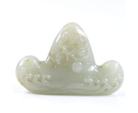 A Chinese relief carved jade calligraphy pen-rest, with wave designs, length 8cm 