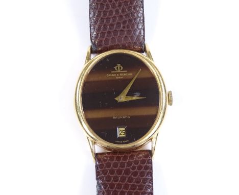 An 18ct gold Baume &amp; Mercier Baumatic Automatic wristwatch, Tiger's Eye effect dial and date aperture, case no. 430434, r