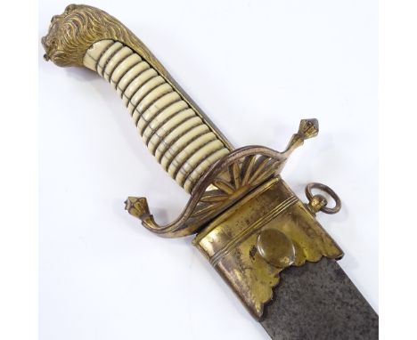 A Georgian Naval Officer's dirk, with gilt-brass lion head pommel and etched blade, with gilt-brass scabbard mounts (leather 