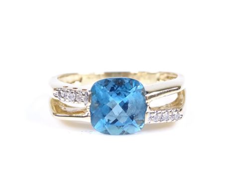 A 9ct gold blue topaz and diamond dress ring, topaz length 8mm, size P, 3.9g 