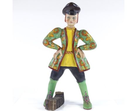 A Lenchi Pottery figure of a boy with an accordion, inscribed Janetti, height 40cm 