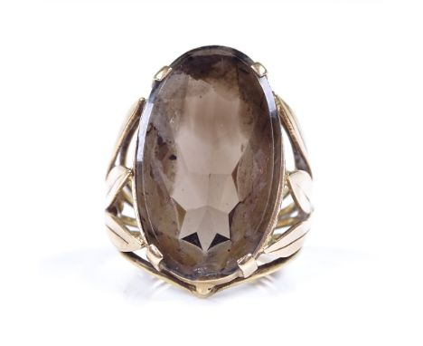 A large 14ct gold smoky quartz tablet ring, setting height 22.9mm, size F, 6.1g 