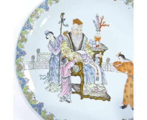 A Chinese porcelain charger, with hand painted enamel court scene, and painted seal marks, diameter 38cm, stapled repaired ri