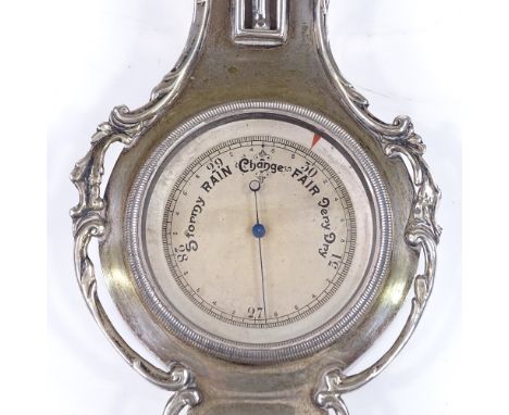 A small silver banjo-shaped barometer / thermometer, with pierced foliate surround, by Henry Matthews, hallmarks Birmingham 1