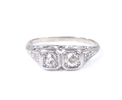 An 18ct white gold 2-stone diamond dress ring, with diamond set shoulders and pierced bridge, setting height 5.2mm, size J, 2