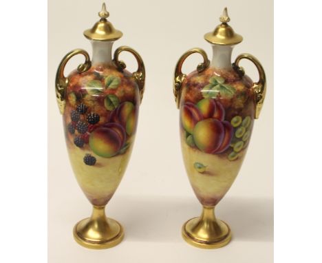 PAIR OF ROYAL WORCESTER FRUIT DESIGN URN SHAPED LIDDED VASES SIGNED BY J SMITH H32CM