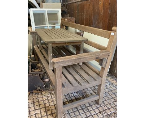 A teak garden table by Lister and a teak garden bench.