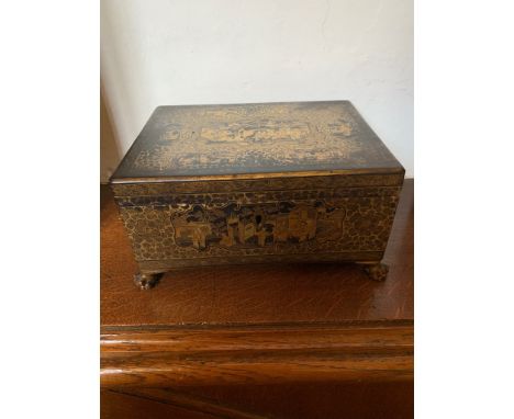 A 19th century Chinese black lacquer and gilt decorated box, the top decorated with cartouche enclosing figures in garden sce