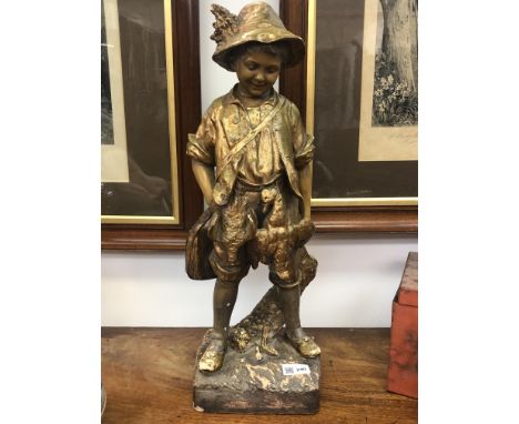 A Goldscheider gilt decorated pottery figure of a boy with a rabbit, impressed 'Fabrique en Autriche' no. 3782, 65, 25. (Dime