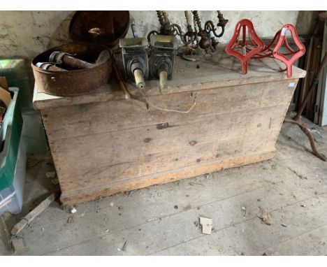 A massive pine trunk with hinged lid.