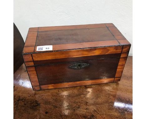 An early 19th century mahogany and satinwood banded tea caddy. (Dimensions: Height 15cm, width 28cm)(Height 15cm, width 28cm)
