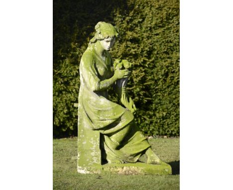 Garden Sculpture: A carved Portland stone figure of Plenty holding a cornucopia  circa 1900 147cm.; 58ins high&#44; together 