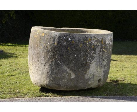 A carved stone cylindrical trough  71cm.; 28ins high by 100cm.; 39ins diameter