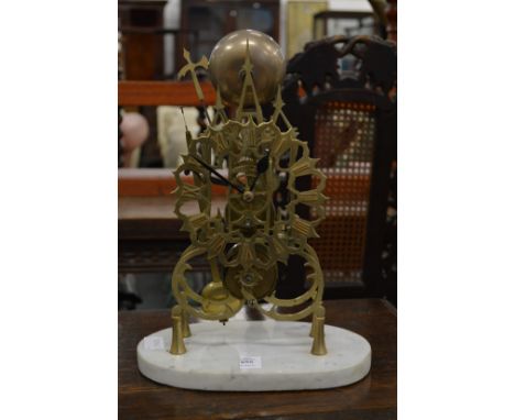 A brass skeleton clock.
