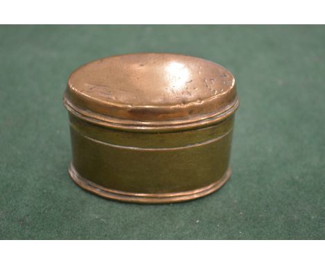 A brass snuff box.