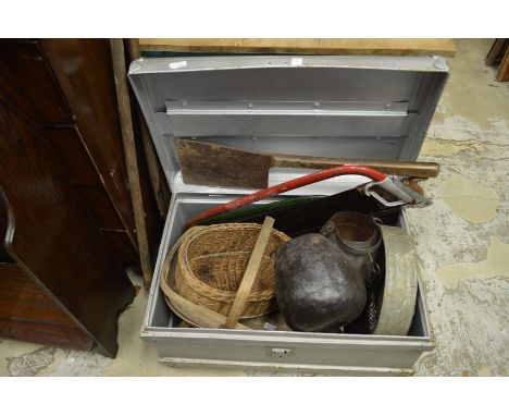 A tin trunk containing a quantity of bygones to include a large meat cleaver, wicker basket etc.