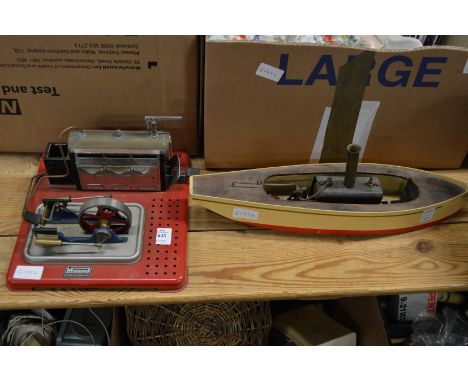 A Mamod stationary engine together with a model steam boat.