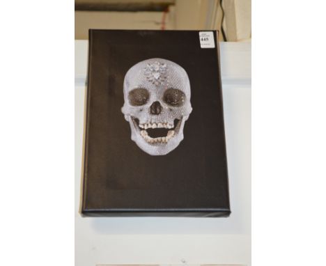 After Damien Hirst, a photographic print on canvas depicting the crystal skull.