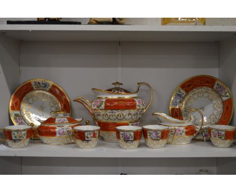 A 19th century part tea service, possibly Chamberlains, gilt and floral decoration with orange panels.