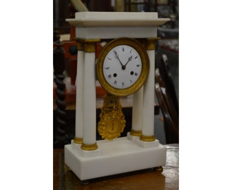 A good white marble and ormolu Portico mantle clock.