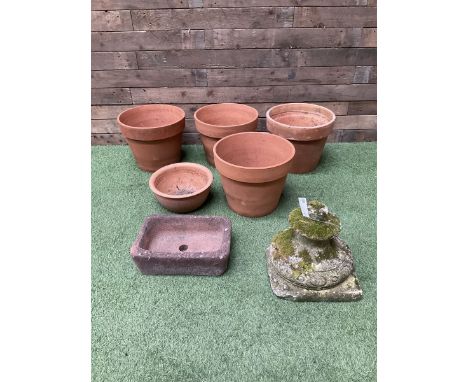 Set of five terracotta planters, small stone trough and urn plinth 