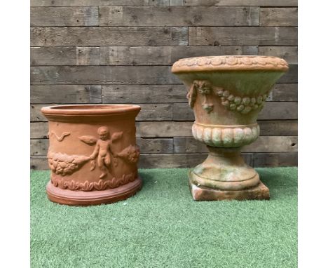 Circular terracotta garden planter, decorated with cherubs and terracotta urn on plinthDimensions: Height:&nbsp;65cm&nbsp; De