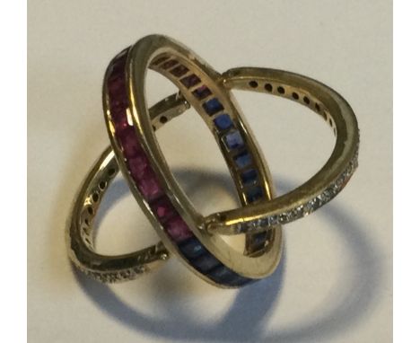 An unusual ruby, sapphire and diamond night and day ring in gold setting. Approx. 4 grams. Est. £200 - £300.
