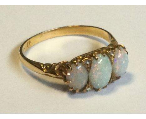 An attractive Victorian opal and diamond seven-stone ring in 18 carat gold setting. Approx. 4 grams. Est. £200 - £300.