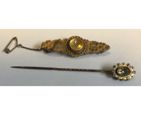 A small Victorian diamond set brooch together with matching stick pin in 15 carat gold setting. Approx. 6 grams. Est. £80 - £