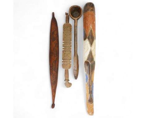 Large African treen grain spoon L62cm; carved wood Berber Tuareg tent peg, West African painted tribal mask 95cm and an Abori
