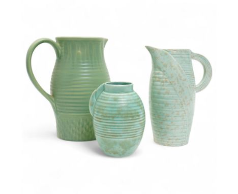 Susie Cooper pottery jug, the green glazed body with ring turned and dimpled decoration, inscribed 'Susie Cooper, England' to