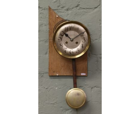 A C1920 clock movement and pendulum.