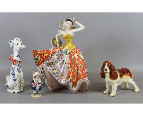 An Italian pottery figure of a flamenco dancer, a Regency Fine Art figure Russell Rabbit and two pottery dogs.