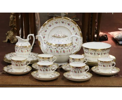 A six setting C20th English tea service decorated with floral sprigs on a cream ground.