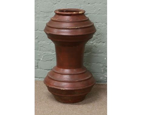 A terracotta double gourd shaped planter with ribbed mouldings.